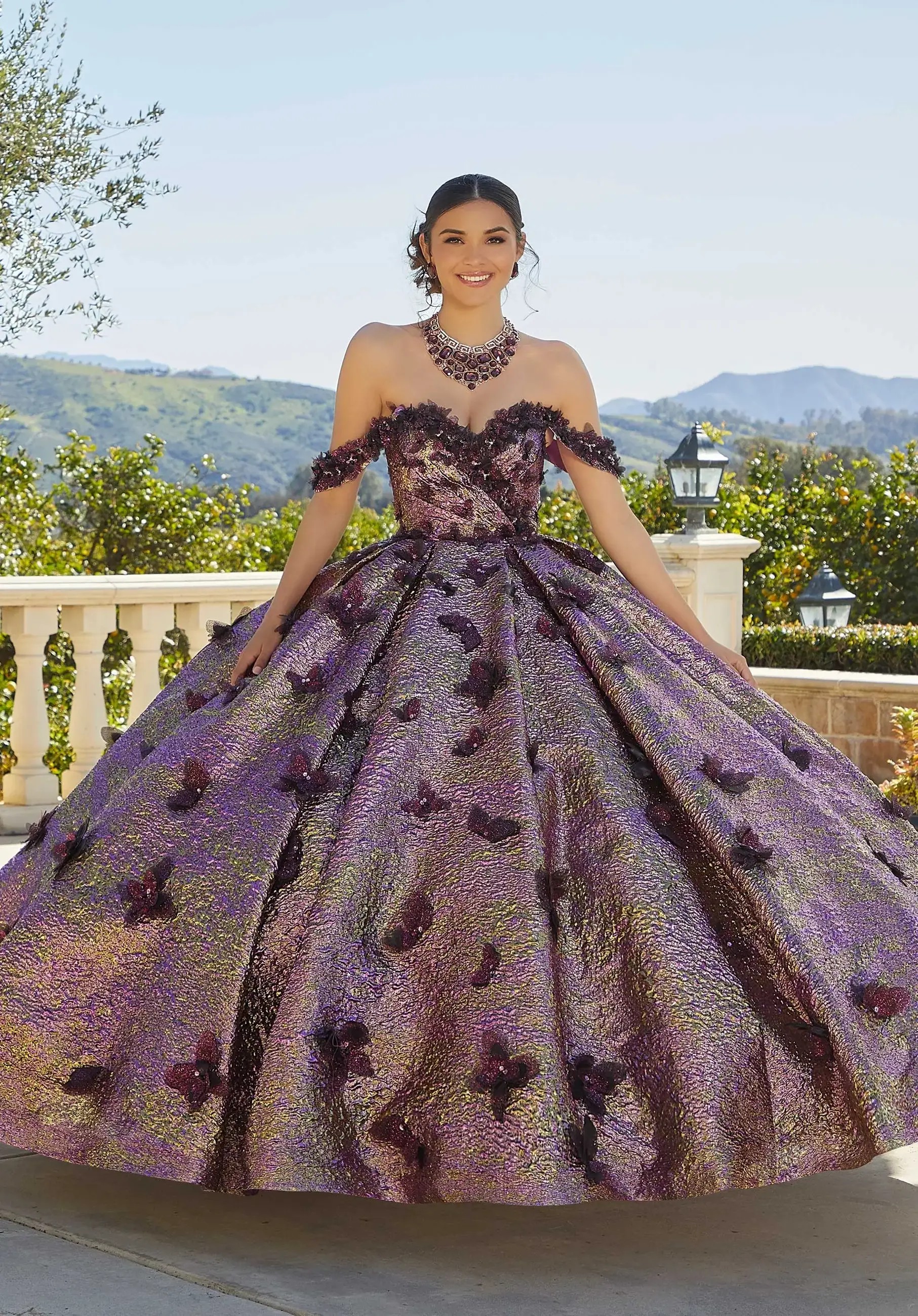 Model wearing a red Morilee Quinceañera dresses