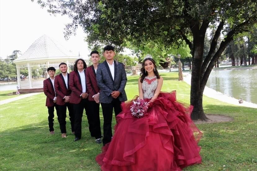 Model wearing a red gown on the grass