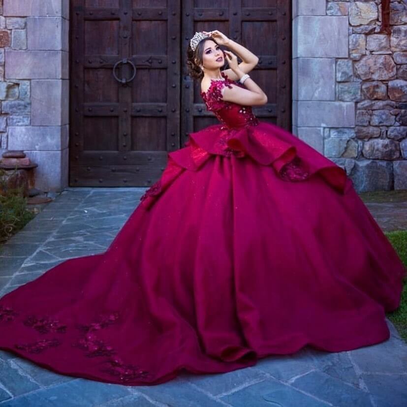 Model wearing a dark red gown
