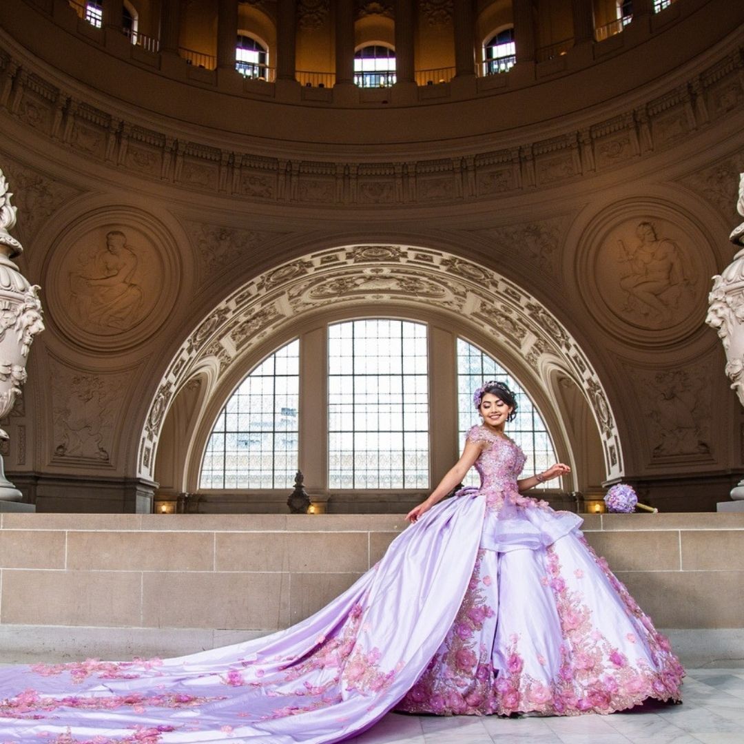 Model wearing a white gown. Mobile image